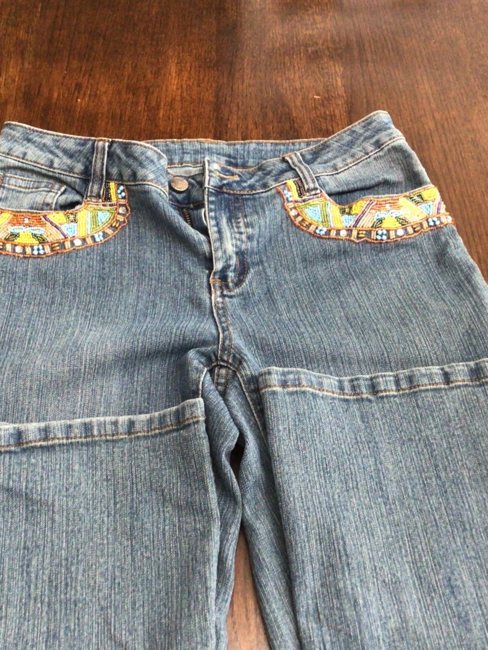 AZI jeans with southwestern beaded front and back pockets. Flare legged  Size 6